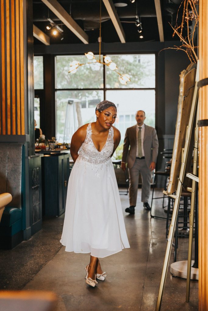 Bride and groom holding hands during their intimate Orlando wedding reception